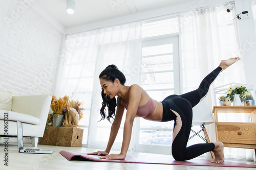 A beautiful Asian woman's fitness at home