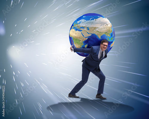 Photography Businessman carrying Earth on his shoulders