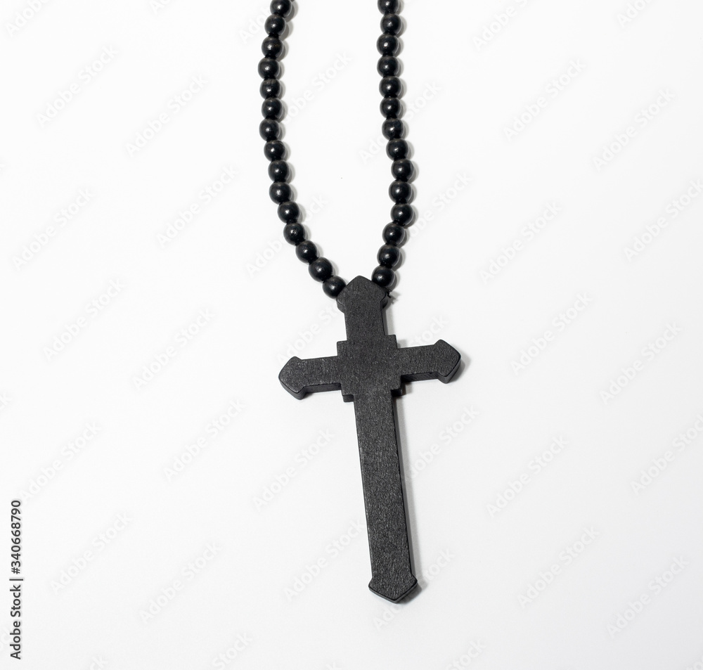 Wood rosary in white background. Brown wooden beads. Wood rosary in white background. Brown wooden beads.