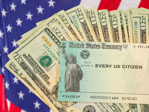 Картината върху платно Stack of 20 dollar bills with US Treasure illustrative check to illustrate coron