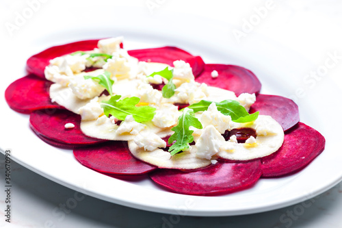 fresh beetroot and apple salad with fresh goat cheese and arugula