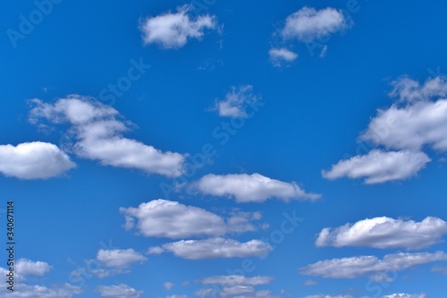 white fluffy clouds in the blue sky