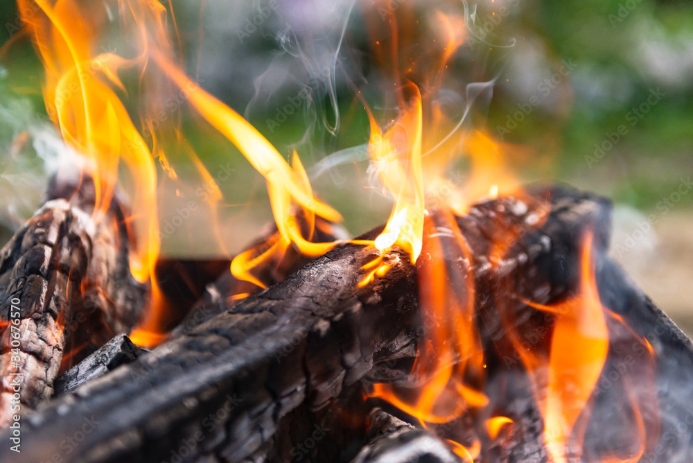 Preparation of coals for frying shish kebab. Summer campfire in the grill. Preparation of coals for frying shish kebab. Summer campfire in the grill.