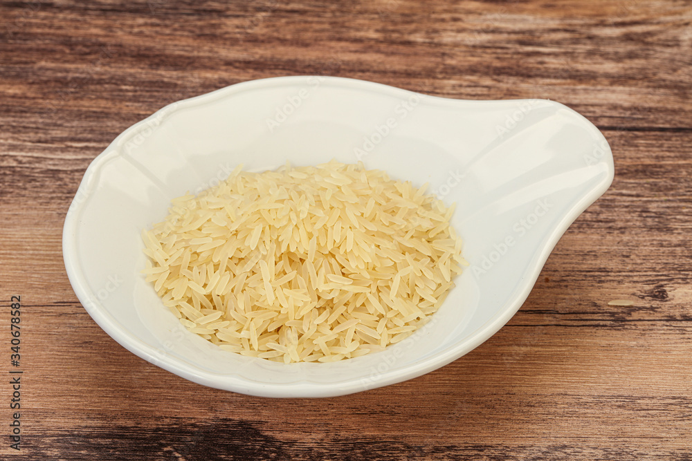 Raw basmati rice in the bowl Raw basmati rice in the bowl