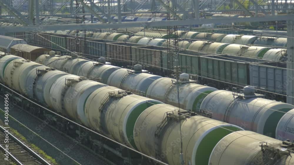 Industrial freight train in the city depot is preparing to ship with cargo. Industrial freight train in the city depot is preparing to ship with cargo.