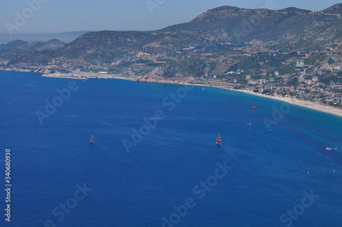 View of the sea bay and ships from the high hill. Beautiful sea landscape on a clear summer day.