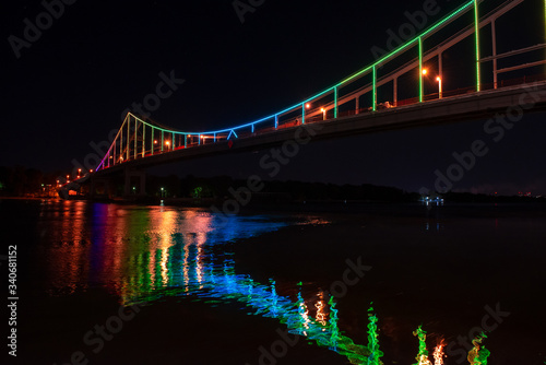 Night view of pedestrian bridge on Dnipro in Kiev Ukraine