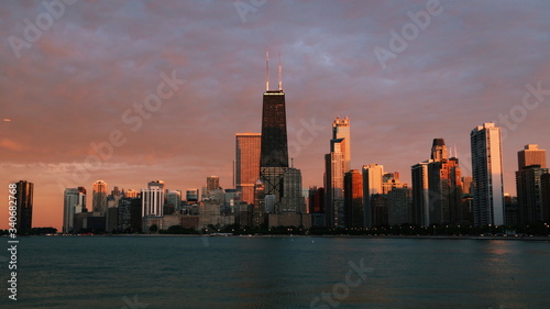 Chicago skyline across Lake Michigan at sunset viewed from North Avenue Beach. Long exposure. © othman