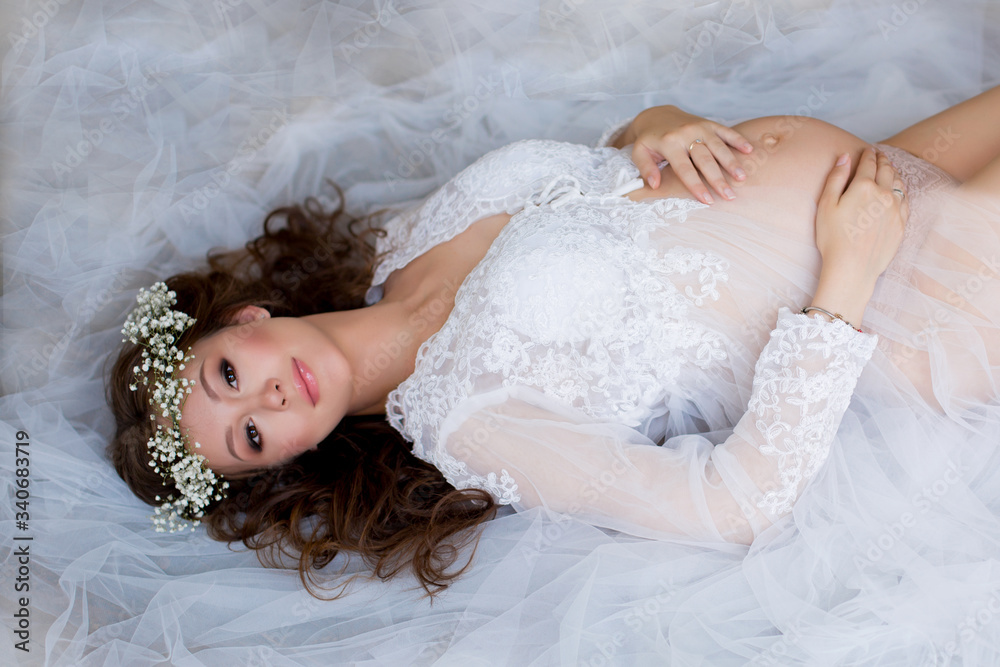 Pregnancy woman at floral wreath Pregnancy woman at floral wreath