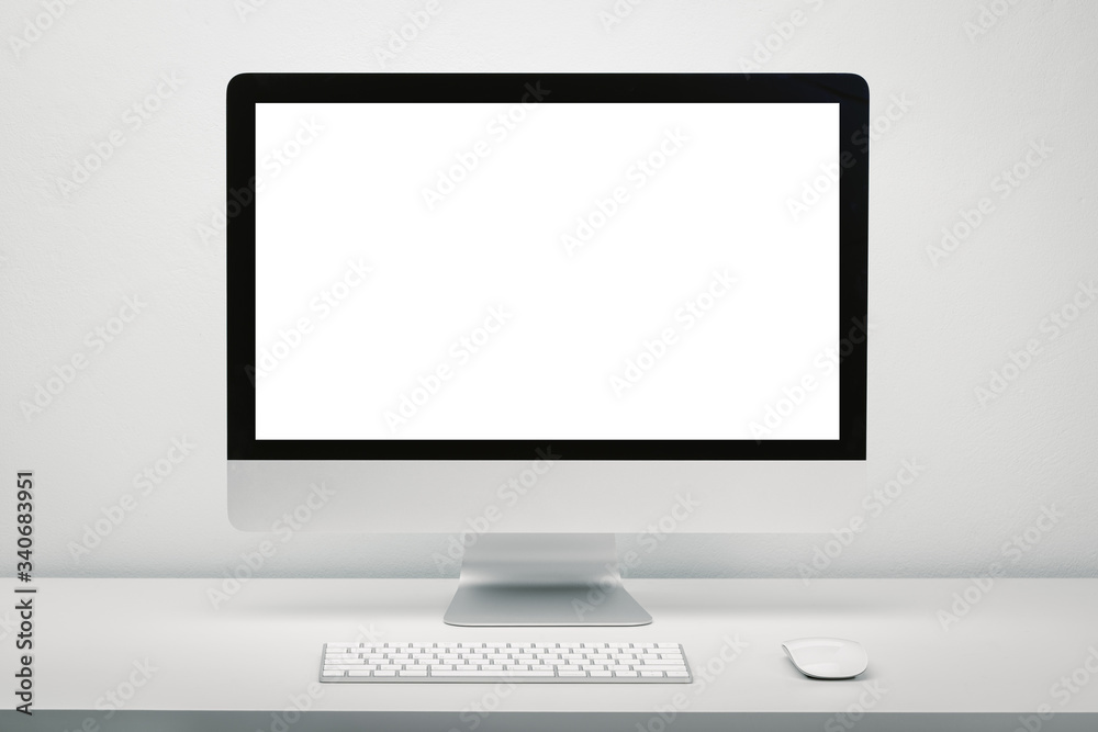 Blank screen computer display for mockup in office interior, Work desk with keyboard and mouse. Blank screen computer display for mockup in office interior, Work desk with keyboard and mouse.