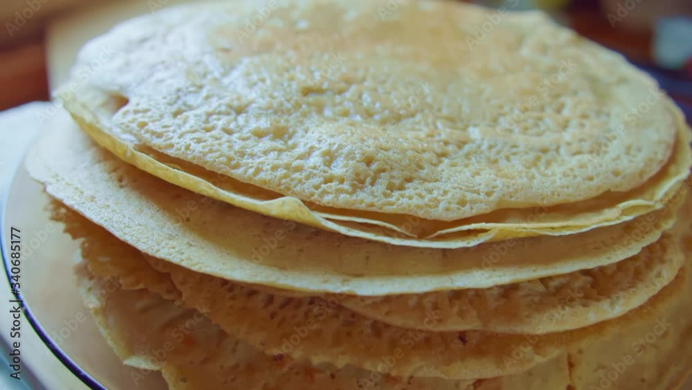 Zoom on yellow delicious pancake stack on glass plate. Slowmo. Side view. Zoom on yellow delicious pancake stack on glass plate. Slowmo. Side view.