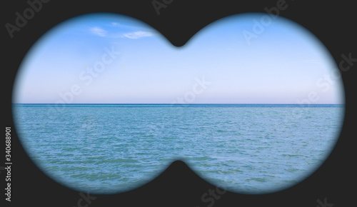 Sea view through binoculars. Seascape view via the field-glass. 
