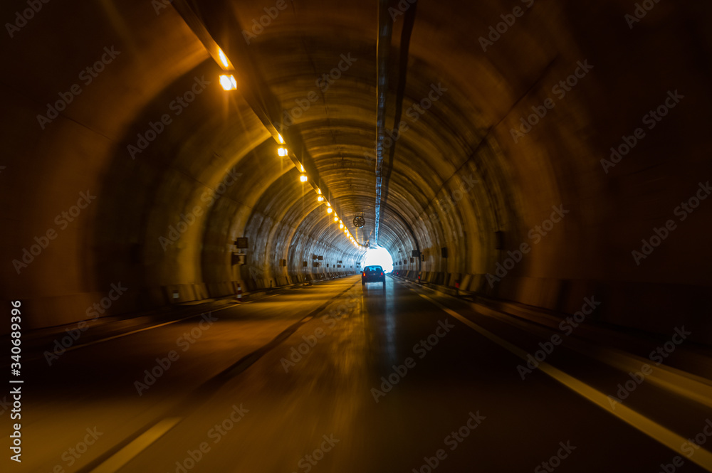 A road, light and tunnel