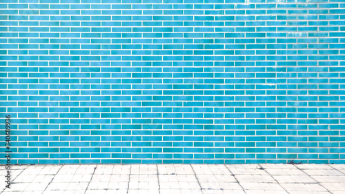 blue brick wall background with gray floor