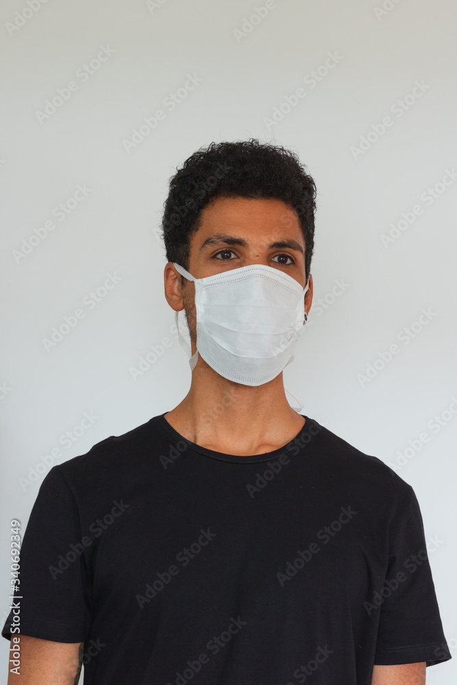 Man adult black wearing coronavirus mask isolated on white Man adult black wearing coronavirus mask isolated on white