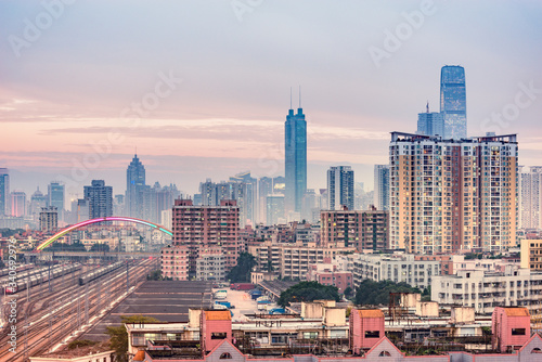 Cityscape and railway station at evening time. Shenzhen. China.