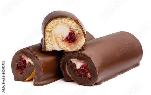 Chocolate cake roll with berry jam and butter cream isolated on white background