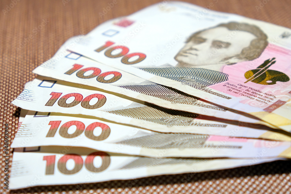 Obraz premium Five Hundred Hrivnas Bank Notes Ukrainian money on a fabric texture background.