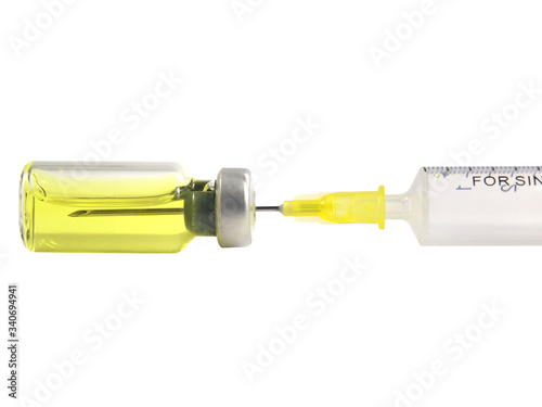 Syringe and vial with yellow serum isolated on white