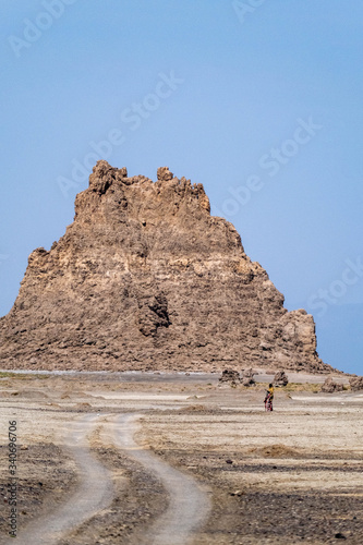 Two people next to a rock formation in lakle Abbe