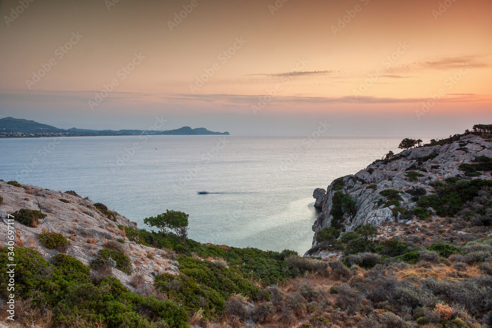 Sunrise at bay near city Kolympia, Rhodes, Greece Sunrise at bay near city Kolympia, Rhodes, Greece
