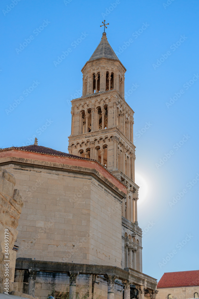 SPLIT, CROATIA - 2017 AUGUST 15.  Sun behind the bell tower of the Cathedral of Saint Domnius.