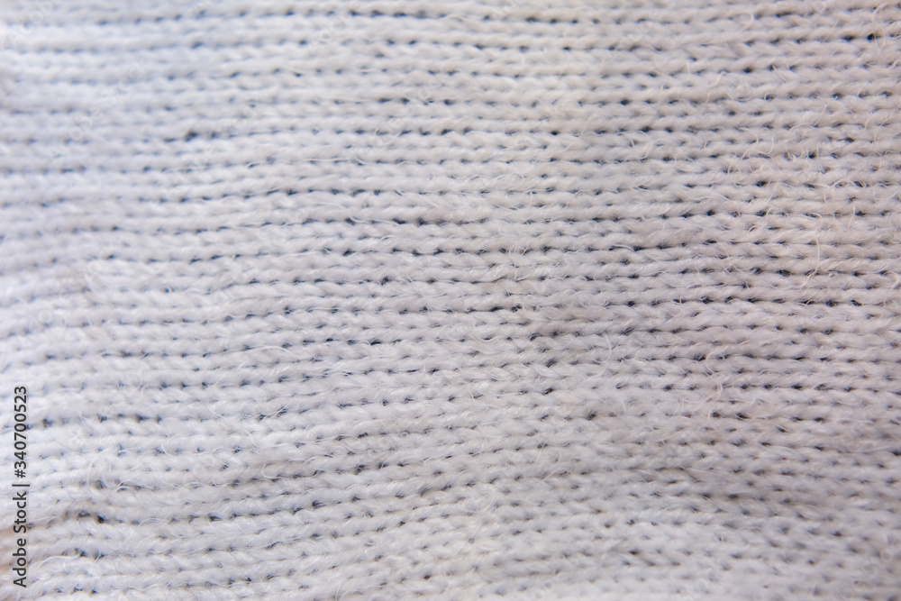 background texture of a white knitted fabric background texture of a white knitted fabric