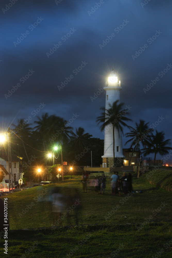a Night Scenery Long Exposure of People Moving of Famous Light House in Old Dutch Fort Galle Sri Lanka Out of focus