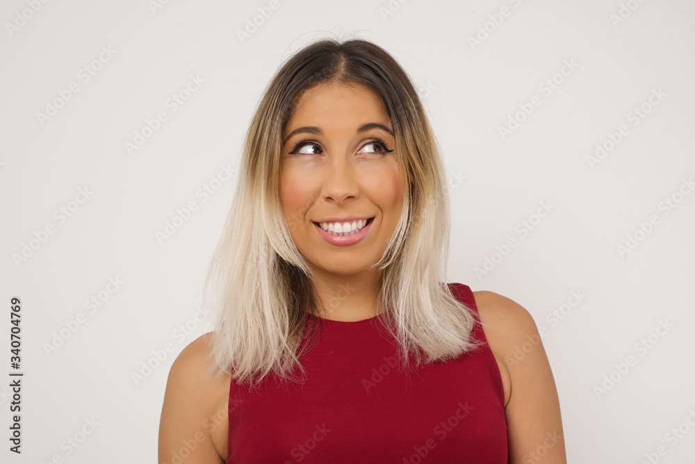 Oops! Portrait of female with specific appearance clenches teeth and looks confusedly aside, realises her bad mistake, poses against copy area for your advertising or promotional background. Oops! Portrait of female with specific appearance clenches teeth and looks confusedly aside, realises her bad mistake, poses against copy area for your advertising or promotional background.