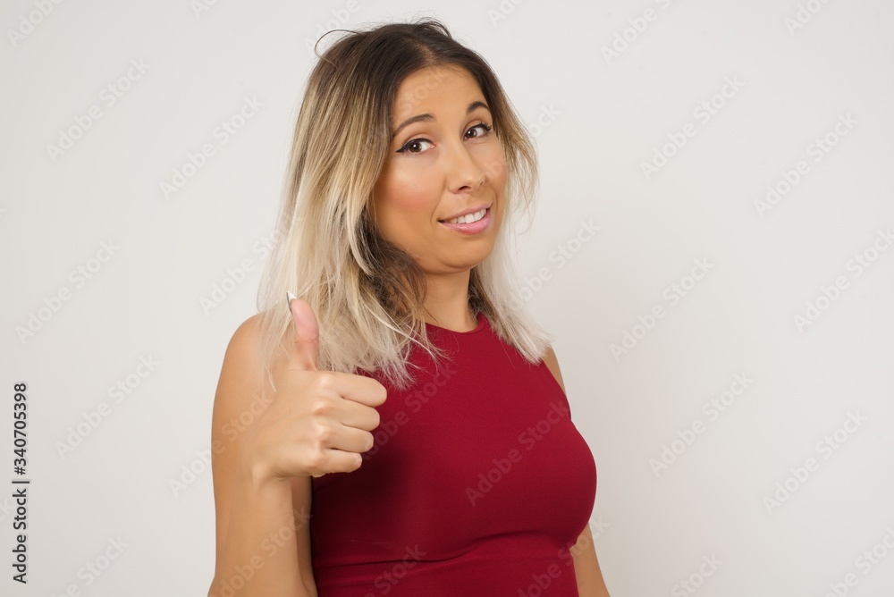 Good job! Portrait of a happy smiling blue eyed young successful woman giving thumb up gesture standing outdoors. Positive human emotion facial expression body language. Funny girl Good job! Portrait of a happy smiling blue eyed young successful woman giving thumb up gesture standing outdoors. Positive human emotion facial expression body language. Funny girl