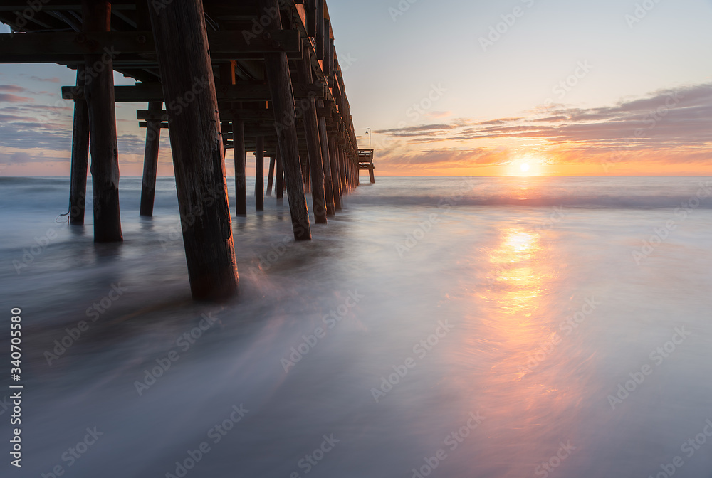 Long exposure photography of sunrise at the Sandbridge Fishing Pier in Virginia Beach