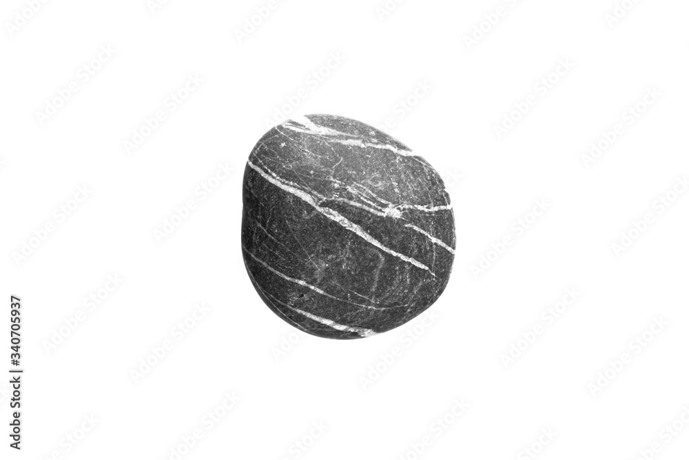 Fototapeta premium Single black stone balanced in a white background