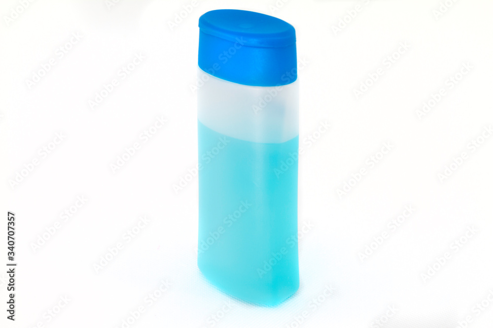 Bottle of blue alcohol gel with white background.  covid-19 prevention