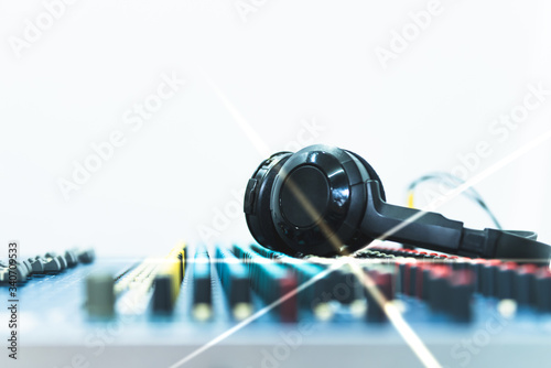 Sticker Blurred soft images of The headphones are placed on the Mixer, which is a music adjustment device, concept to equipment for musical entertainment