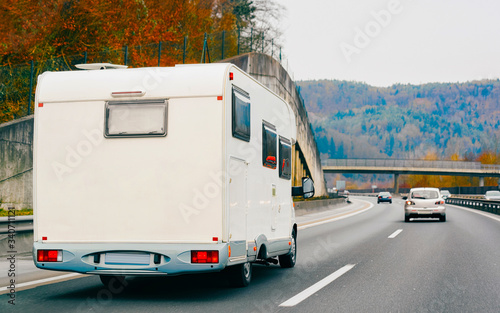 White Camper rv in road on highway reflex