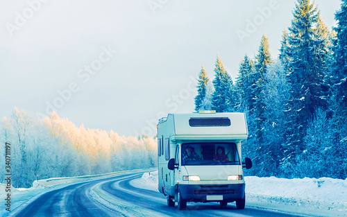Caravan in road in winter Rovaniemi reflex