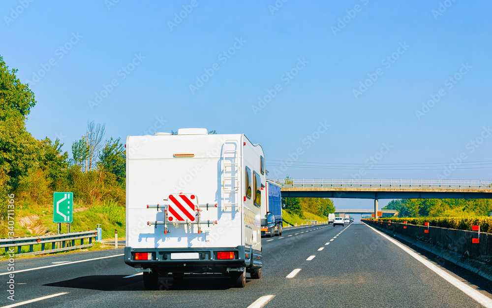 RV Caravan Car on Road Camper and motorhome Italy reflex