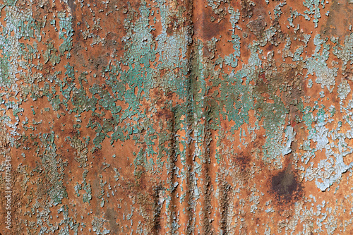Closeup background of ridged metal with crazed paint and rust texture, copy space, horizontal aspect