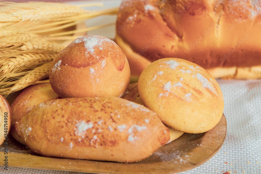 Baked breads on wooden table background. Baked breads on wooden table background.