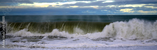 Big pacific ocean waves crashing on the shore of Napier Beach, New Zealand
