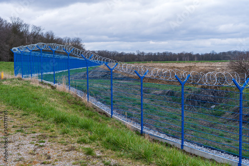 Prison barbed wire. Prison fence. Strict punishment for crimes
