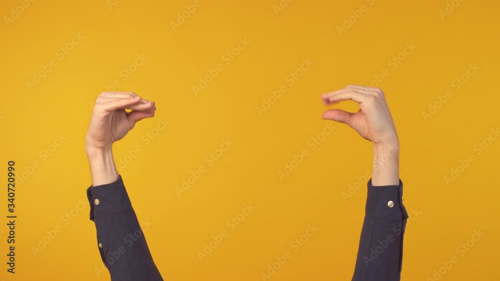 Man hands showing bla bla gesture over yellow background. Two hands sign