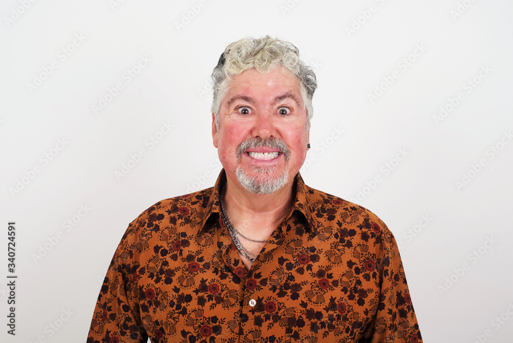Young handsome man having broad white smile being excited to meet Friends and go out to have a good day. Young handsome man having broad white smile being excited to meet Friends and go out to have a good day.