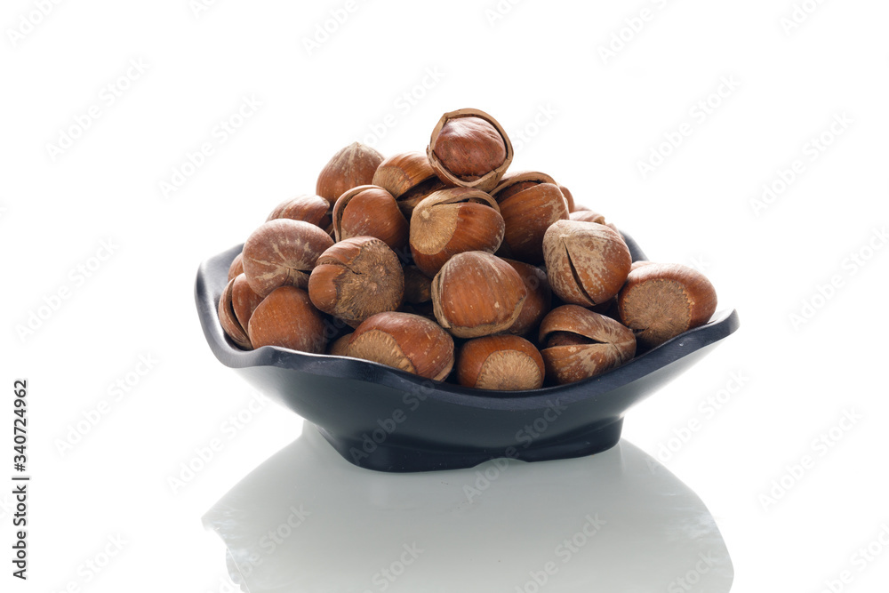 Hazelnut nuts on a white board Hazelnut nuts on a white board
