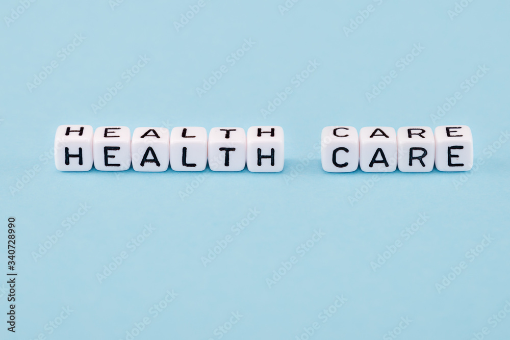 word composed with cubes on a blue background word composed with cubes on a blue background