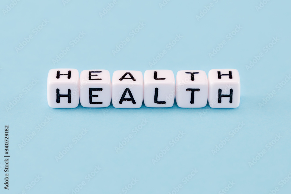 word composed with cubes on a blue background word composed with cubes on a blue background
