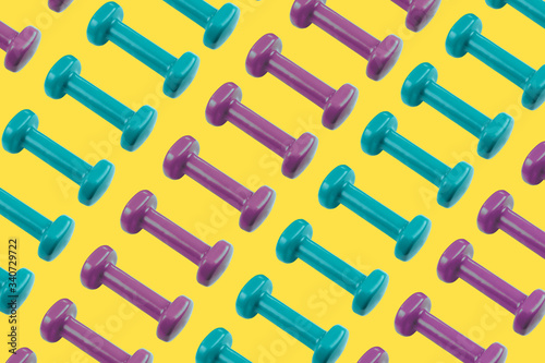Colorful pattern made of blue and purple dumbbells © Woodenmen