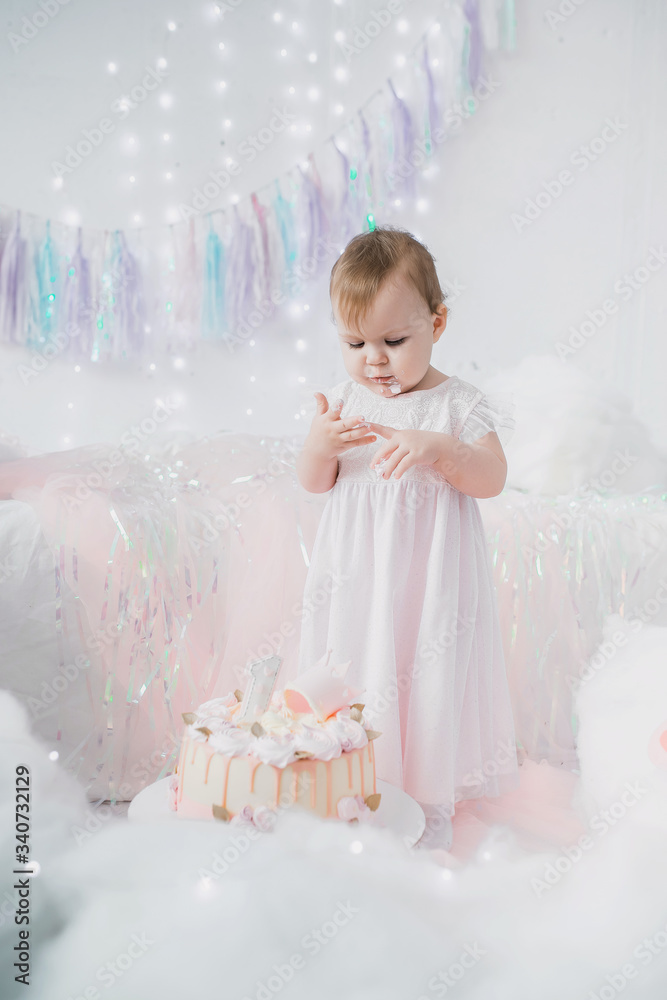 first birthday of a little girl in a pink dress first birthday of a little girl in a pink dress