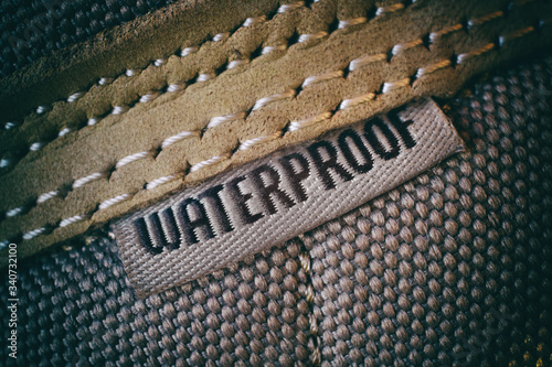 Waterproof label on hiking mountain shoes, close-up view photo