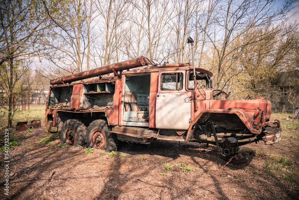 Old rusty abandoned Soviet fire truck in Chernobyl exclusion zone Ukraine